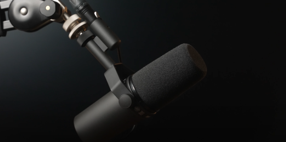 Close-up of a dynamic microphone on a black background